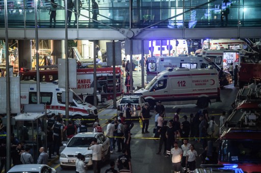 Forensic police work the explosion site at Ataturk airport on June 28, 2016 in Istanbul after two explosions followed by gunfire hit Turkey