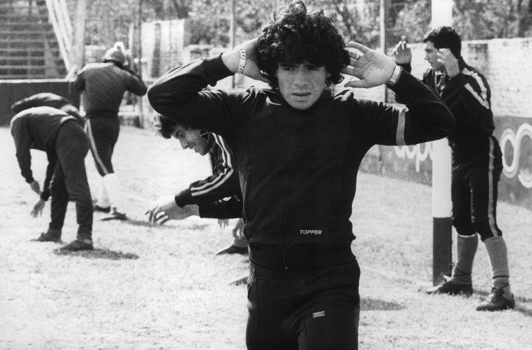 Diego Maradona, 16, warms up 12 September 1977 in Buenos Aires. Maradona was born on the 30th of October 1960 in Villa Fiorito, one the poorest suburbs of Buenos Aires. Most people consider him as the best soccerplayer ever in the history of soccer. Het started playing when he was 9 years old. His first club was Cebollitas, the youthteam of Argentinos Juniors. Because of his unknown talent he soon got the nickname Pibe de Oro, which literally means Golden Boy. He played through his 15th for the youthteam. On his 16th he debuted in professional football with Argentinos Juniors. And a few months later he already debuted in the national team of Argentina. AFP PHOTO / AFP PHOTO