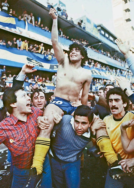 (FILE) This 1981 picture shoes Argentine soccer star Diego Armando Maradona, being carried by fans after winning the 1981 local Championship with Boca Juniors at La Bombonera stadium in Buenos Aires. Boca Juniors, the most popular football club in Argentina, celebrates on April 3rd, 2005, its centenary - from its creation by a group of football enthusiast in a humble neighbourhood of immigrants, until reaching the world