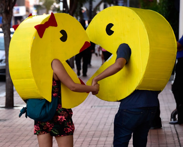 SAN DIEGO, CA - JULY 22: Pac-Man and Ms Pac-Man cosplayers attend Comic-Con International on July 22, 2016 in San Diego, California. Frazer Harrison/Getty Images/AFP