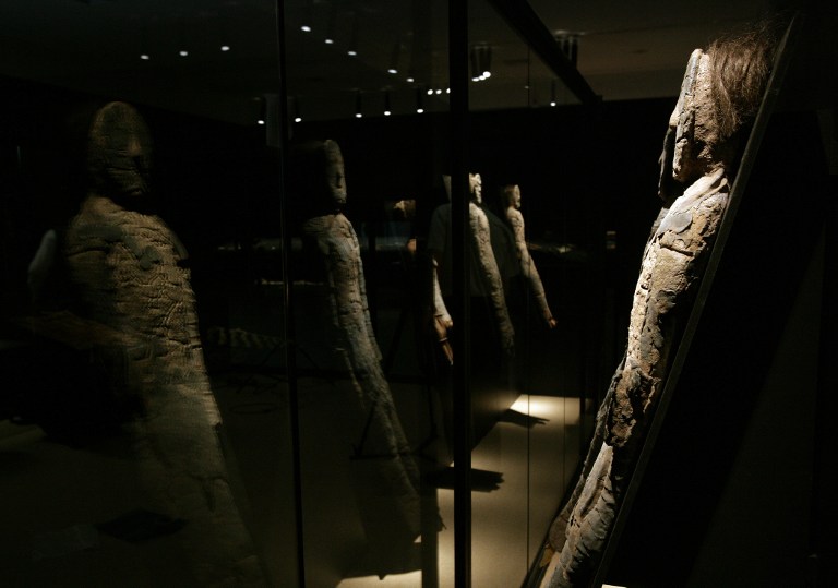 A group of Chinchorro mummies -dated between 5000 B.C. and 3000 B.C.- are reflected on a mirror while on display during the exhibition "Arica, a thousand-year-old culture", on August 27, 2008, in the cultural centre of the La Moneda presidential palace in Santiago. In the Chinchorro culture, everyone who died was mummified, and it was not a symbol of high social status.