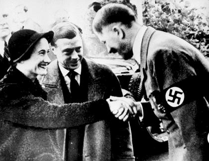 (FILES) Picture dated 23 October 1937 of the Duke of Windsor (C), the great great uncle of Prince Harry, and his wife Wallis Simpson meeting the German Chancellor Adolf Hitler. Prince Harry has apologised after being pictured in a Nazi uniform at a fancy dress party. The Sun