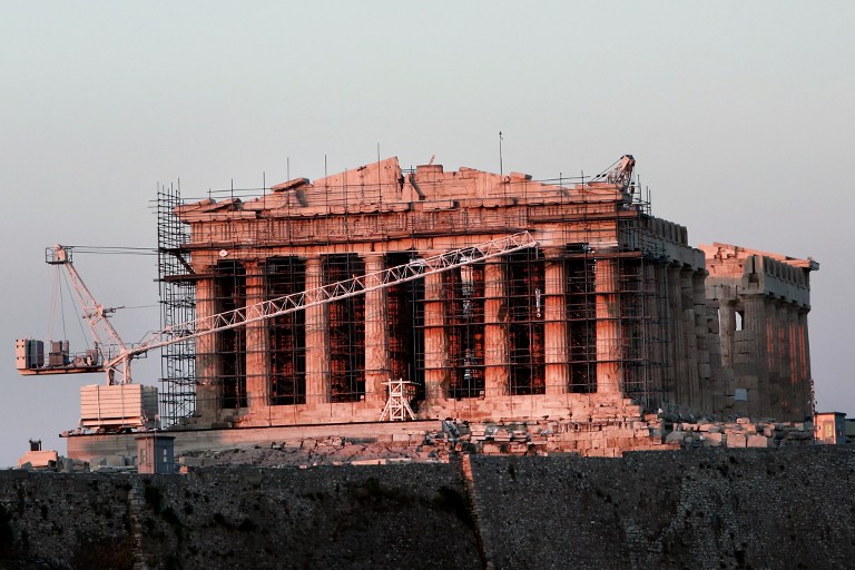 This photo taken on August 4, 2016 shows restoration work at the ancient temple of the Parthenon, atop the Acropolis hill in Athens, on August 4, 2016. Restoration work on Athens