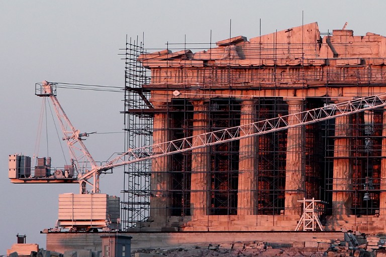 This photo taken on August 4, 2016 shows restoration work at the ancient temple of the Parthenon, atop the Acropolis hill in Athens, on August 4, 2016. Restoration work on Athens