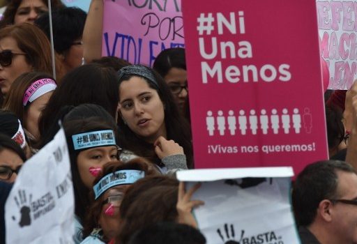 Thousands of demonstrators participate in the "Ni una menos" (Not One Less) march through the center of Lima to the palace of justice holding banners and posters condemning gender violence and femicide - gender-based killings - on August 13, 2016. / AFP PHOTO / CRIS BOURONCLE