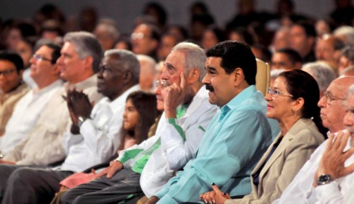 Former Cuban President Fidel Castro (C), sitting next to Venezuelan President Nicolas Maduro (3rd R), attends the celebration of his 90th birthday at the Karl Marx theatre in Havana on August 13, 2016. / AFP PHOTO / AIN / Oriol de la Cruz