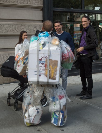Rob Greenfield, an environmental activist who is spending a month in New York, has hanging on himself all the trash he