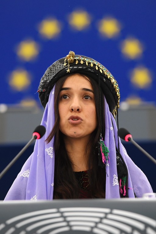 Nadia Murad , public advocates for the Yazidi community in Iraq and survivors of sexual enslavement by the Islamic State jihadists delivers a speech after being awarded co-laureate of the 2016 Sakharov human rights prize, on December 13, 2016 at the European parliament in Strasbourg. / AFP PHOTO / FREDERICK FLORIN