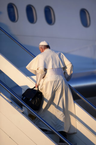 Pope Francis boards a plane at Rome's Fiumicino Airport ahead of his four-day apostolic trip to Chile. Filippo Monteforte | Agence France-Presse