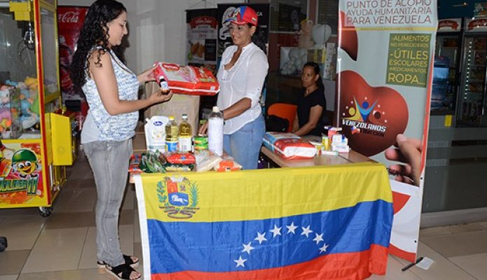 venezolanos-recoletan-donaciones-en-el-maule-para-enviarlas-a-su-pas-en-medio-de-crisis-humanitaria-e1549903879412-696x400.jpg