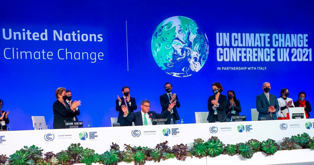 En el centro de la foto está Alok Sharma, presidente de la COP26.