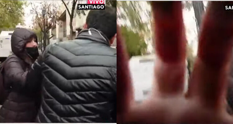 Un manifestante increpando a periodista de Tu Día en medio de despacho.