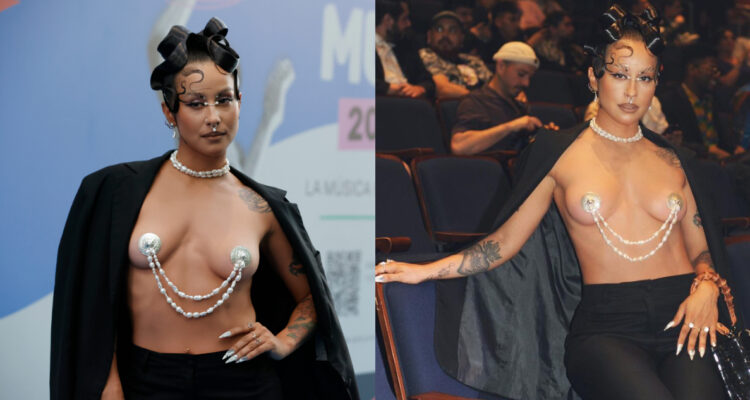 Denise Rosenthal posando para la cámara con su look caracterizado por llevar el torso desnudo.