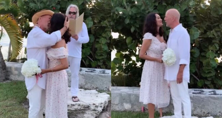 Bruce Willis y Emma Haming en la ceremonia para renovar sus votos. Ambos están de bñanco y se besan.