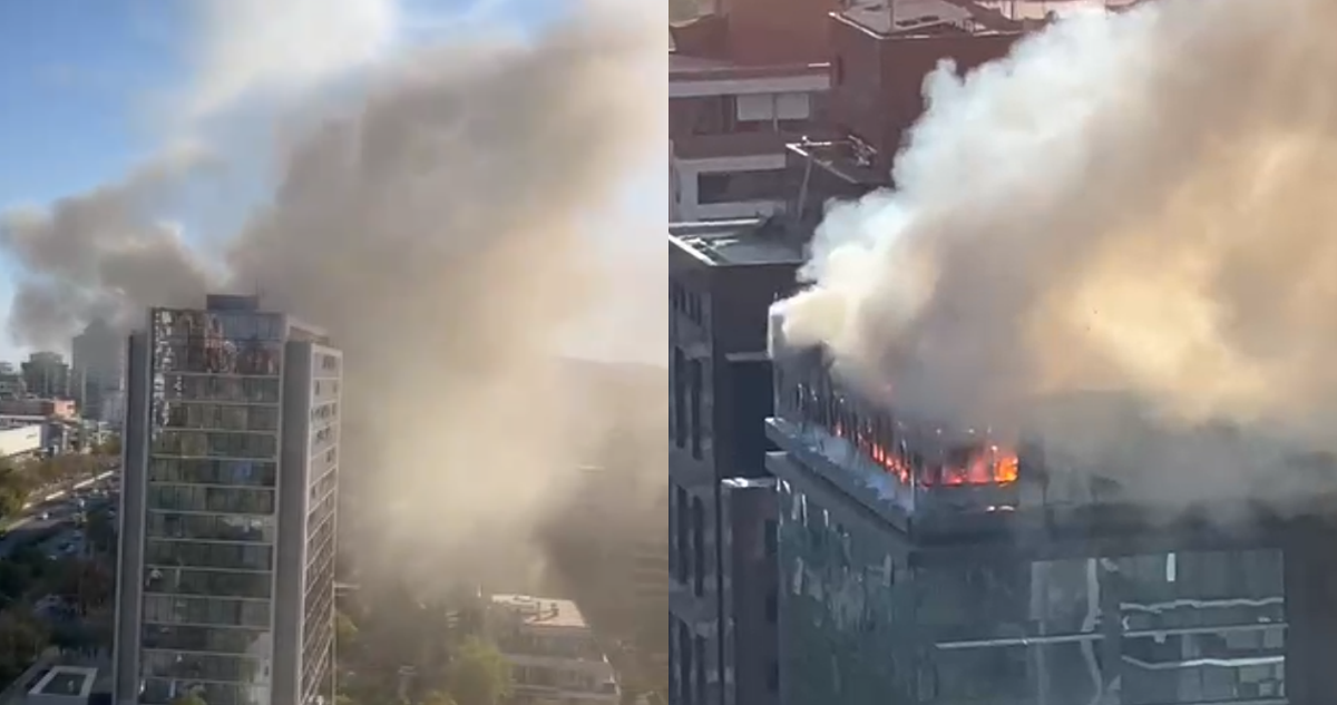 Gran incendio afecta a edificio en Vitacura: hay desprendimiento de vidrios