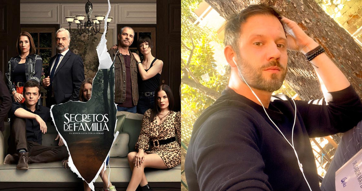 Hernán Contreras posa serio para la cámara. A su lado, el póster de la teleserie Secretos de Familia.