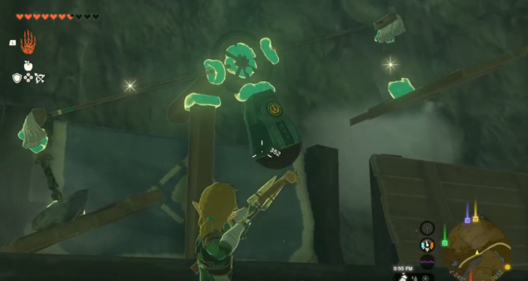 Link en The Legend of Zelda: Tears of the Kingdom, usando una balanza para medir su propio peso con manzanas.