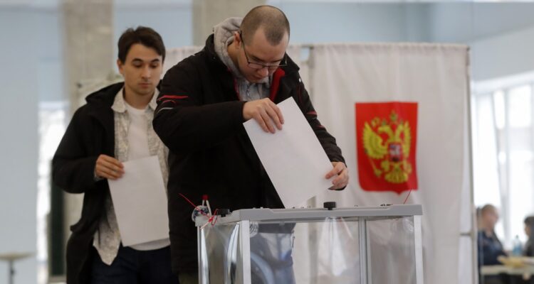 A Russian man casts his ballot during the presidential elections at a polling station in Moscow, Russia, 17 March 2024. The Federation Council has scheduled presidential elections for 17 March 2024. Voting will last three days: March 15, 16 and 17. Four candidates registered by the Central Election Commission of the Russian Federation are vying for the post of head of state: Leonid Slutsky, Nikolai Kharitonov, Vladislav Davankov and Vladimir Putin.