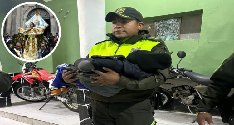 Policía sosteniendo a niño abandonado en fiesta religiosa de Gran Poder