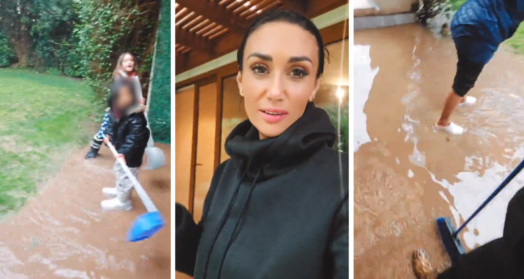 Pamela Díaz junto a su familia sacando agua de su terraza por inundación