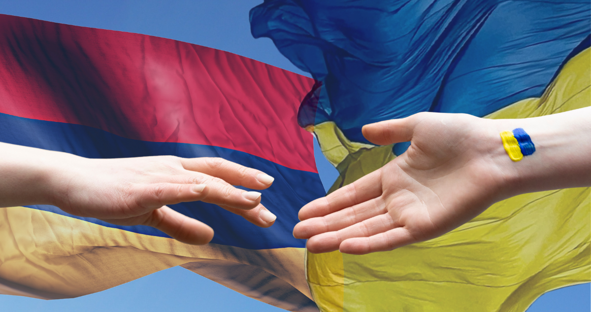 Banderas de Armenia y Ucrania. Manos.