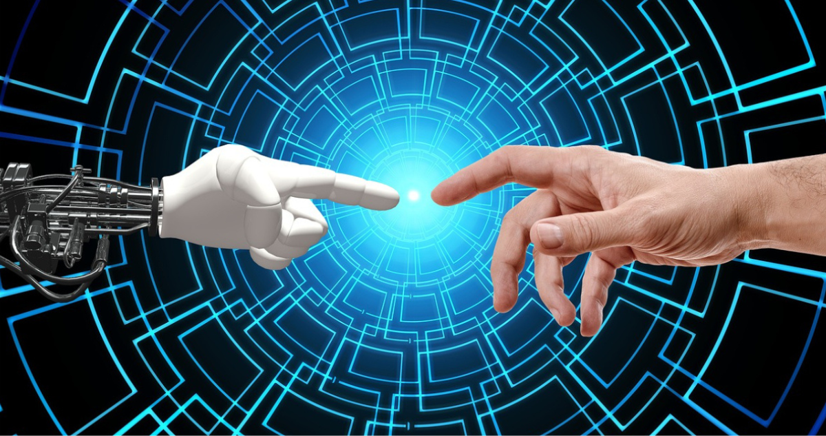 Foto de contexto de mano humana y mano robótica, para temática sobre IA.